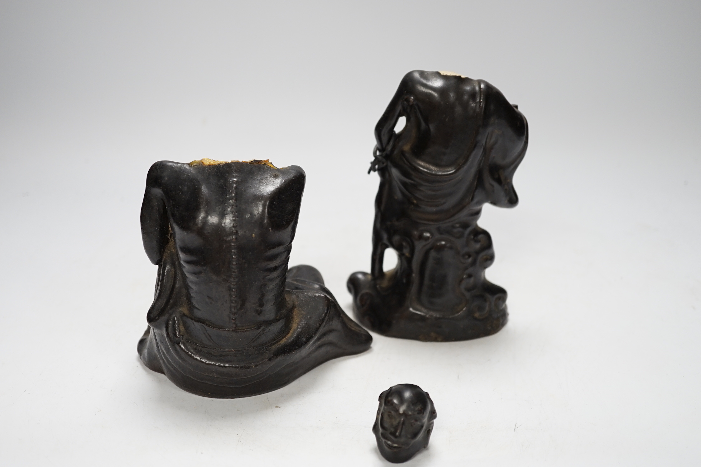 Two Chinese pottery figures of luohan, damaged, 15.5cm